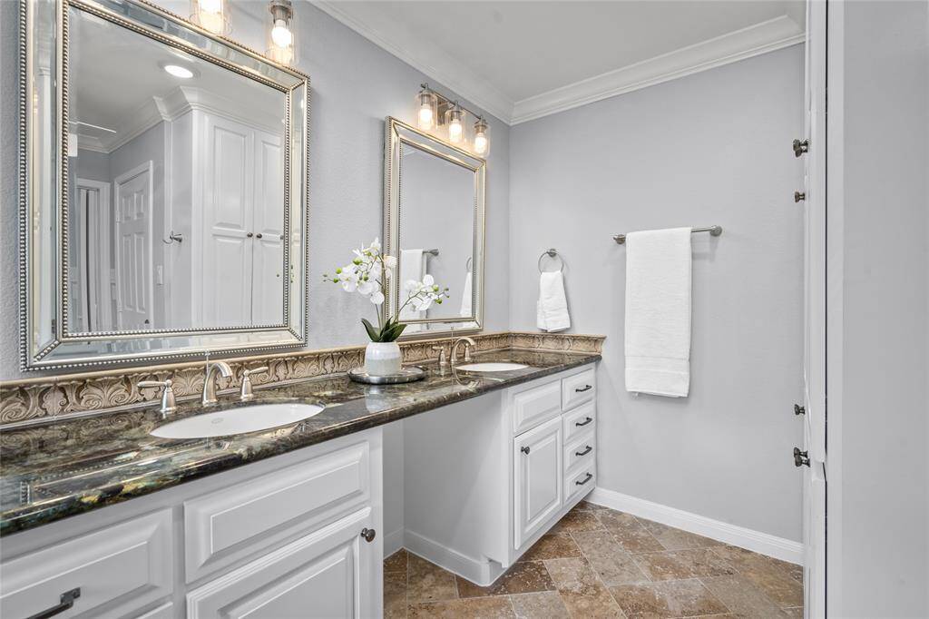 PRIMARY BATHROOM - Dual sinks and plenty of storage space. Private water closet and sit down vanity.