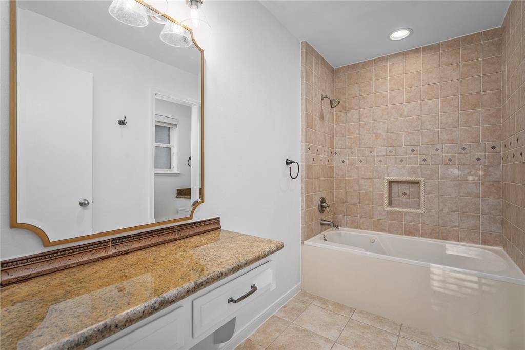 GUEST HOUSE BATHROOM - Full Bathroom with a shower/tub combo, vanity area, and private water closet.