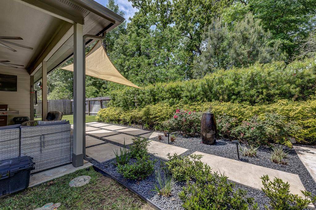 Private backyard fit with extended patio perfect for entertaining year round
