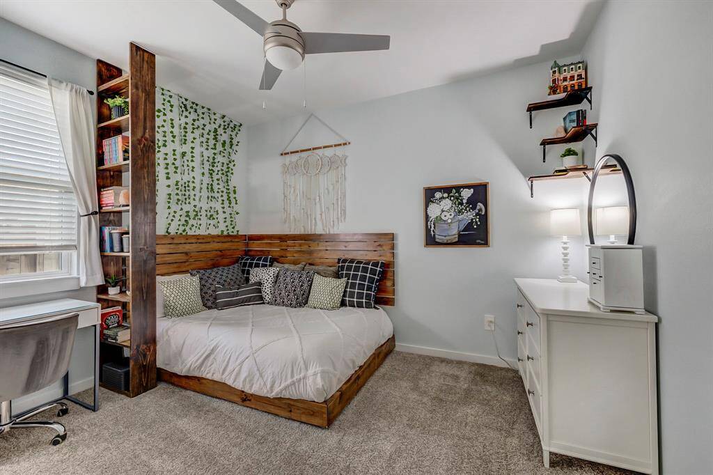 Enjoy a quiet space to focus in this dual purpose office or bedroom with ceiling fan