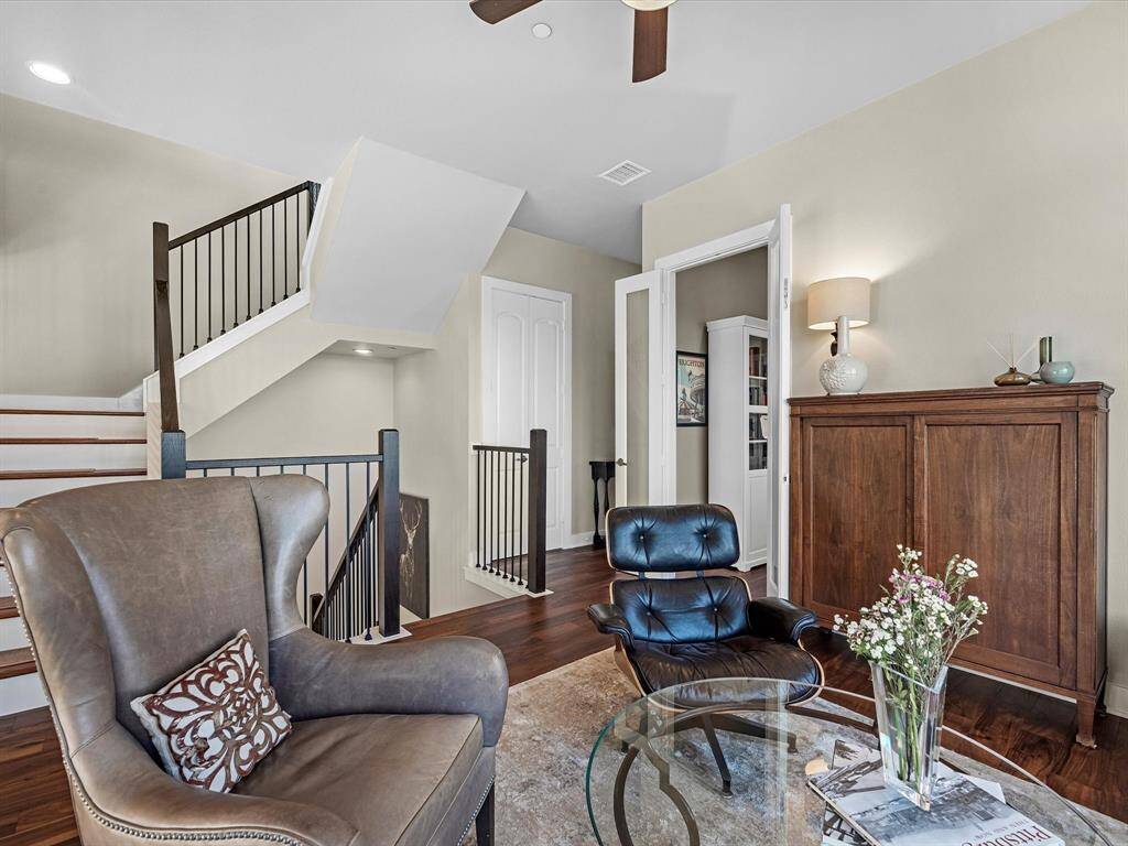 Living/loft area features warm wood flooring.