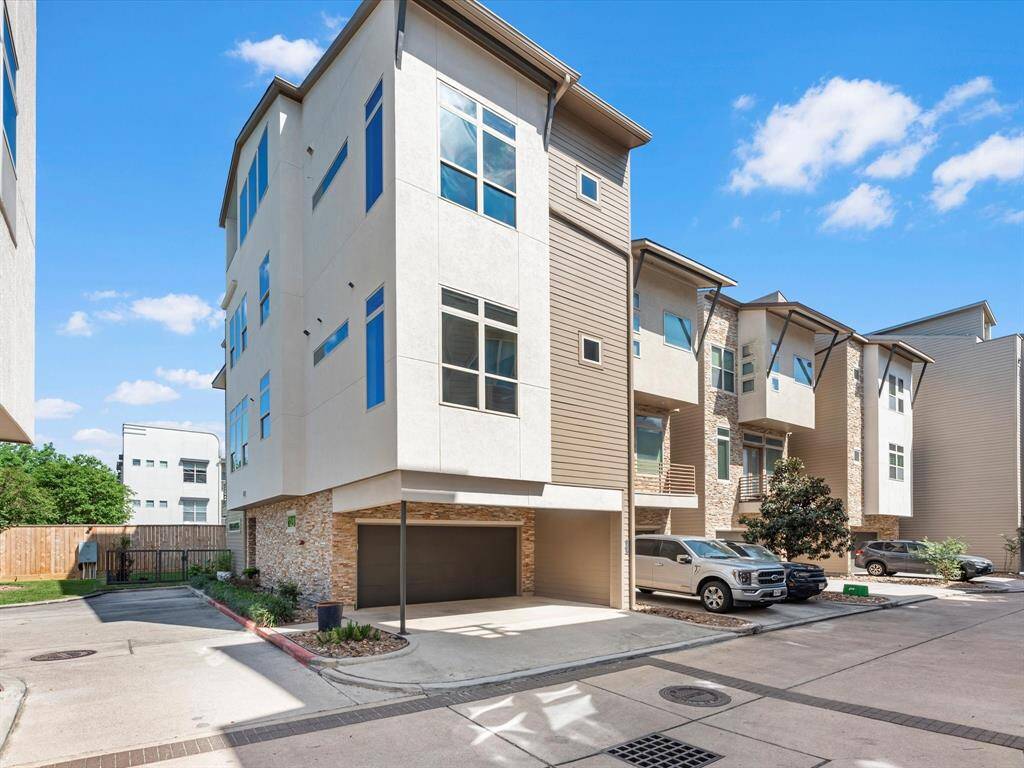 Contemporary multi-story single family residence with sleek architectural lines and expansive windows. Include a two-car garage and driveway with ample space to accomodate two additional vehicles along with guest parking close by.
