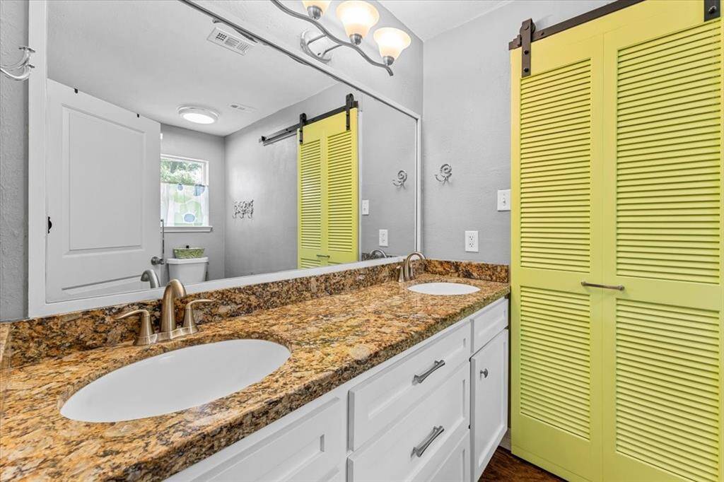 Primary suite bathroom with lots of light.