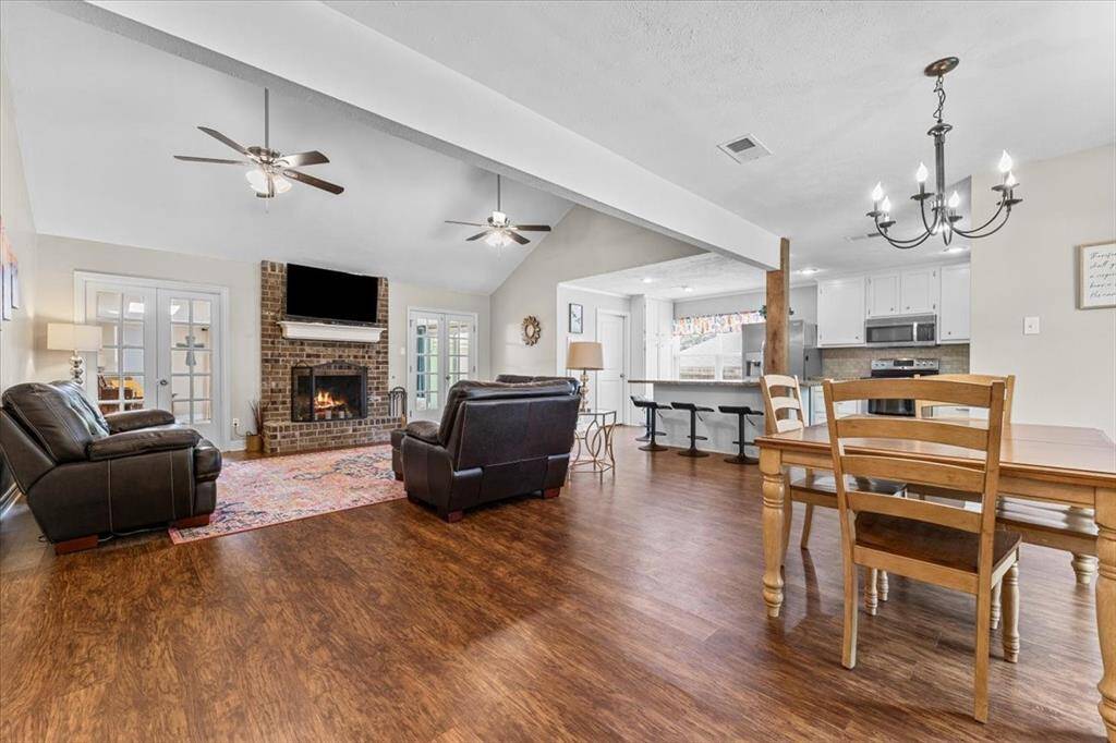 Open concept living space with high ceilings and natural light.