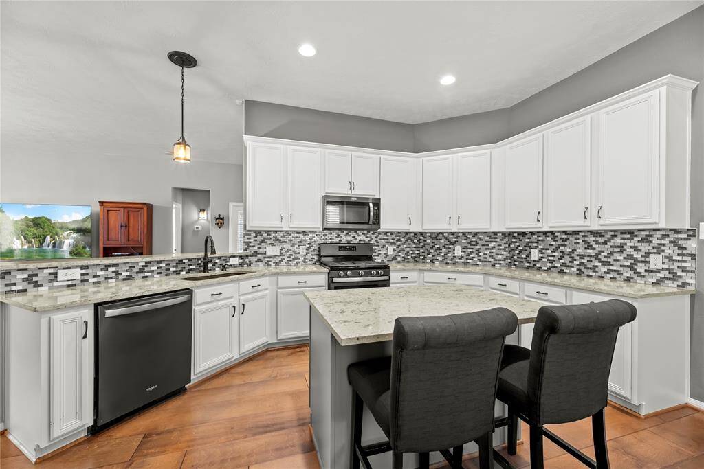 Plenty of cabinets and counter areas for cooking and entertainment.