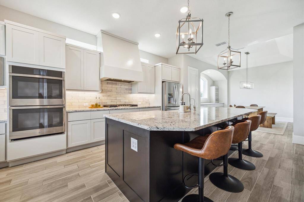 Double ovens make cooking in this kitchen so enjoyable.