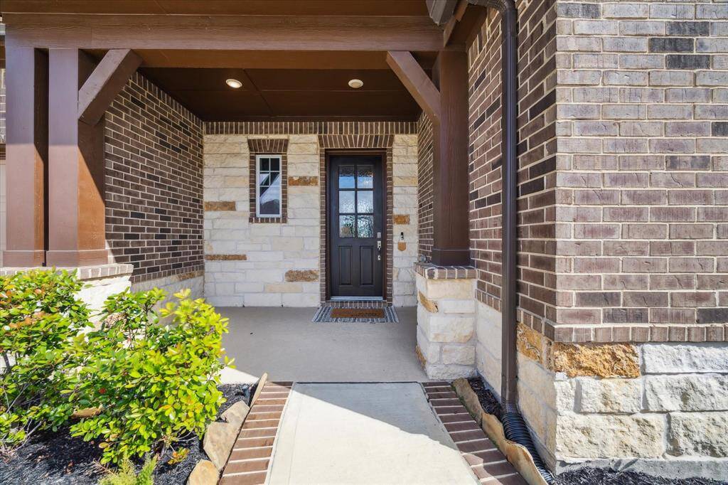 Welcoming and beautiful landscaped front porch.