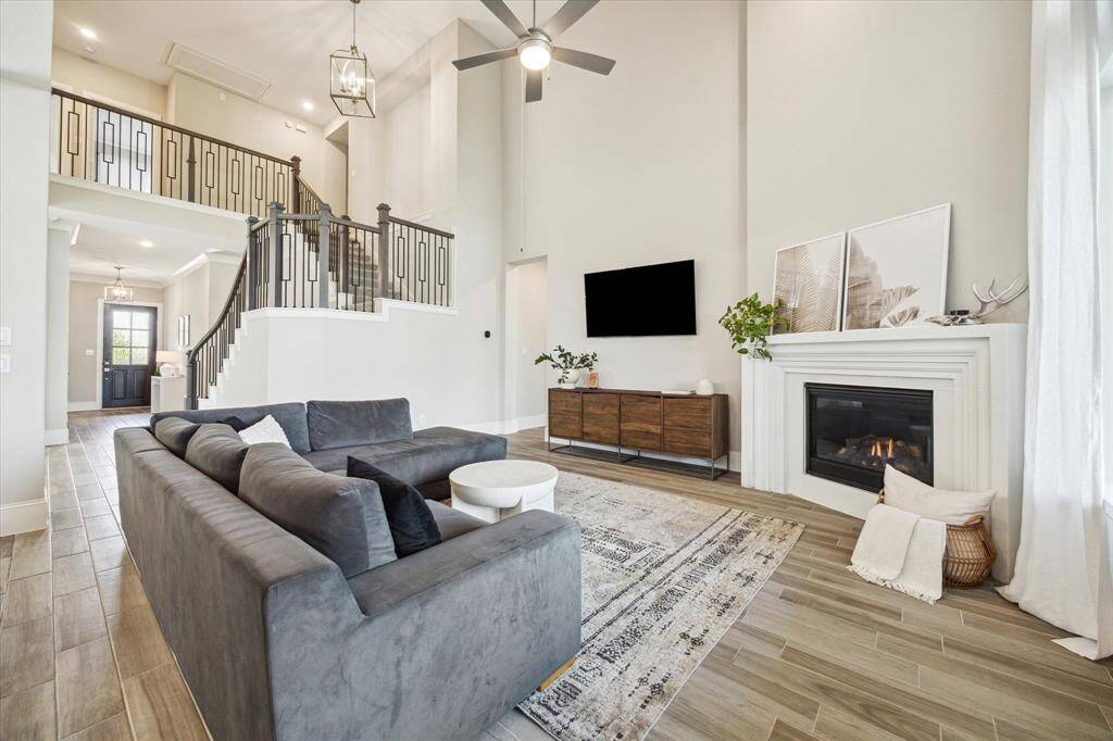 Living room has soaring two story ceilings.
