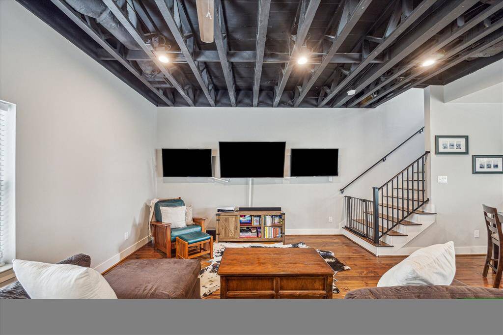 The wall space in this living area is ideal for multiple screens or artwork