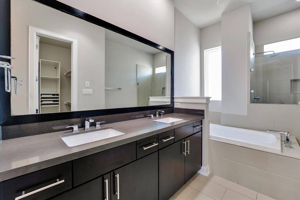 Primary Bath with a jacuzzi tub and a walk in shower