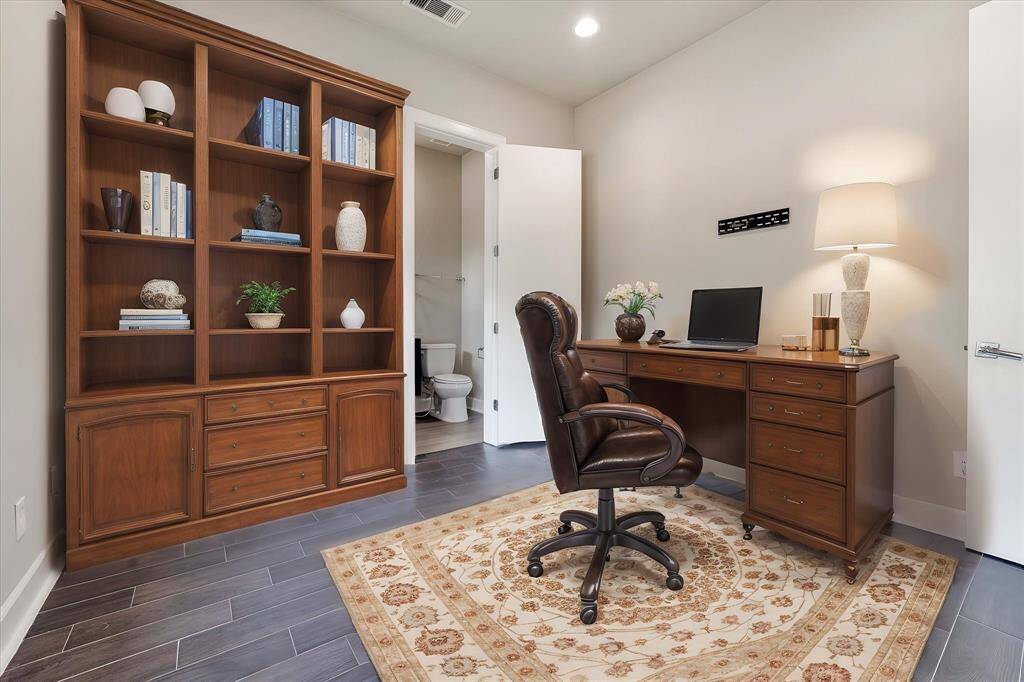 Virtually staged bedroom on the 1st floor just as you enter the front door