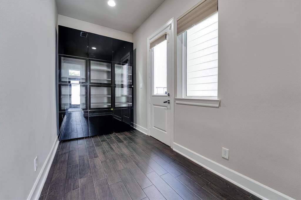 Custom cabinets by the back door and garage