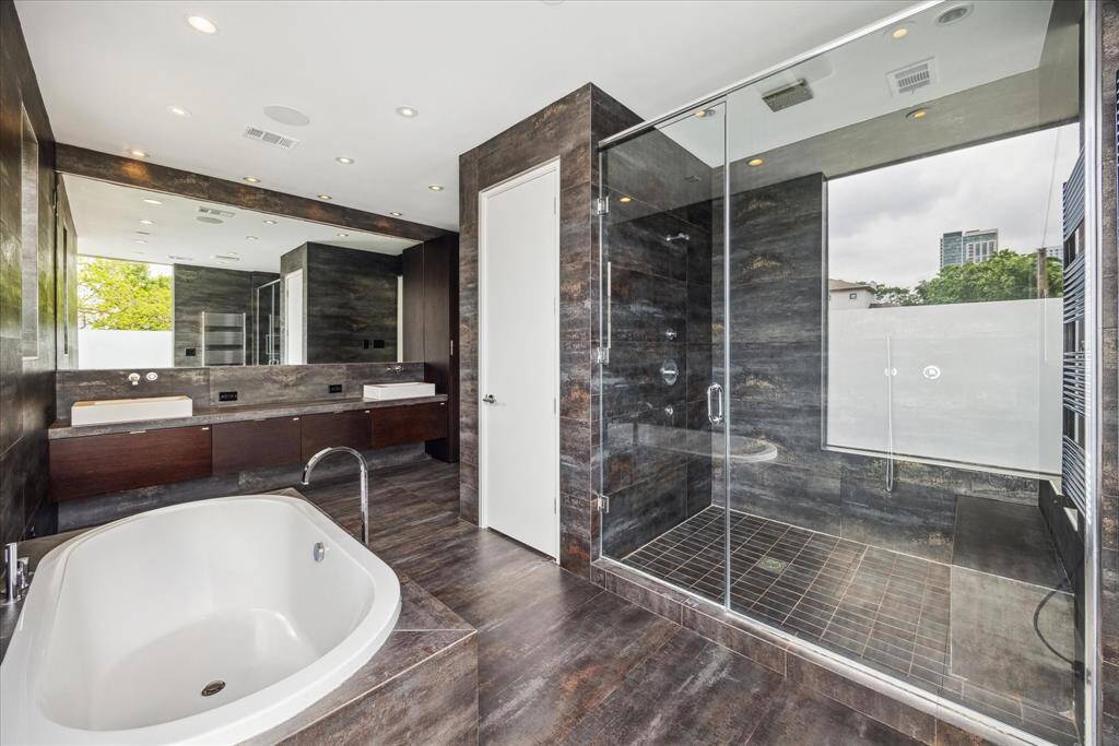 Large Primary bathroom with soaking tub, shower and separate water closet