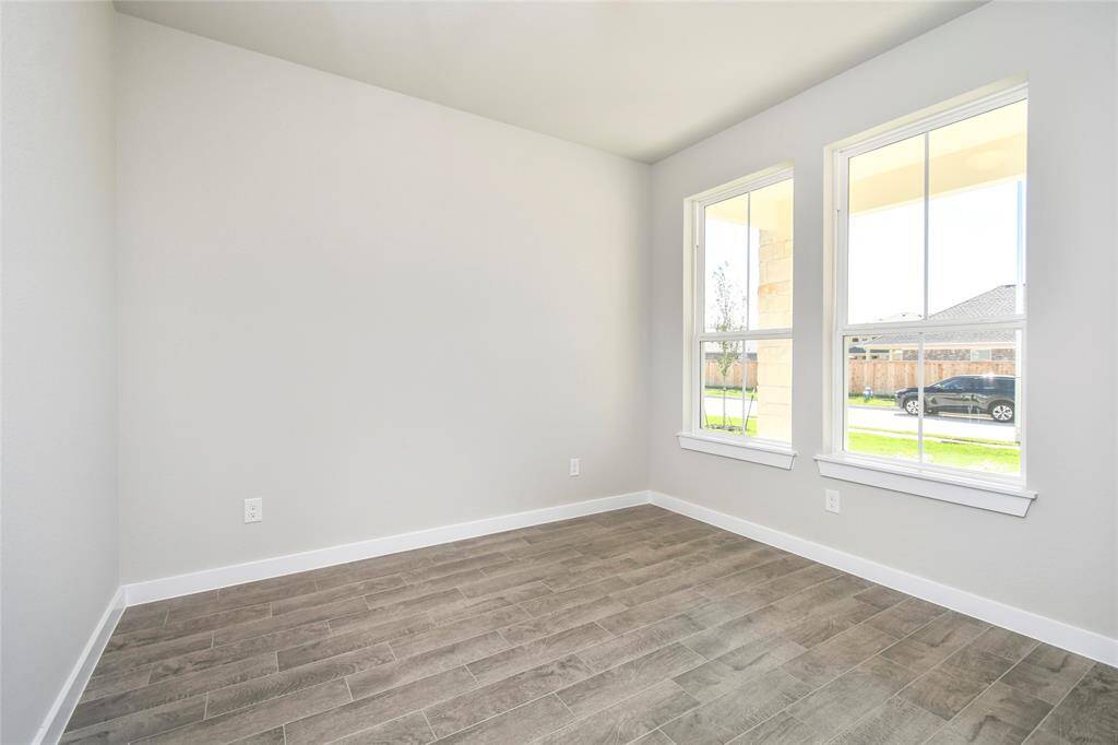 Make memories gathered around the table with your family and friends! This dining spacious room features elegant flooring, custom paint, and adjacent to family room and kitchen for open concept feel. Sample photo of completed home with similar floor plan. Actual colors and selections may vary.
