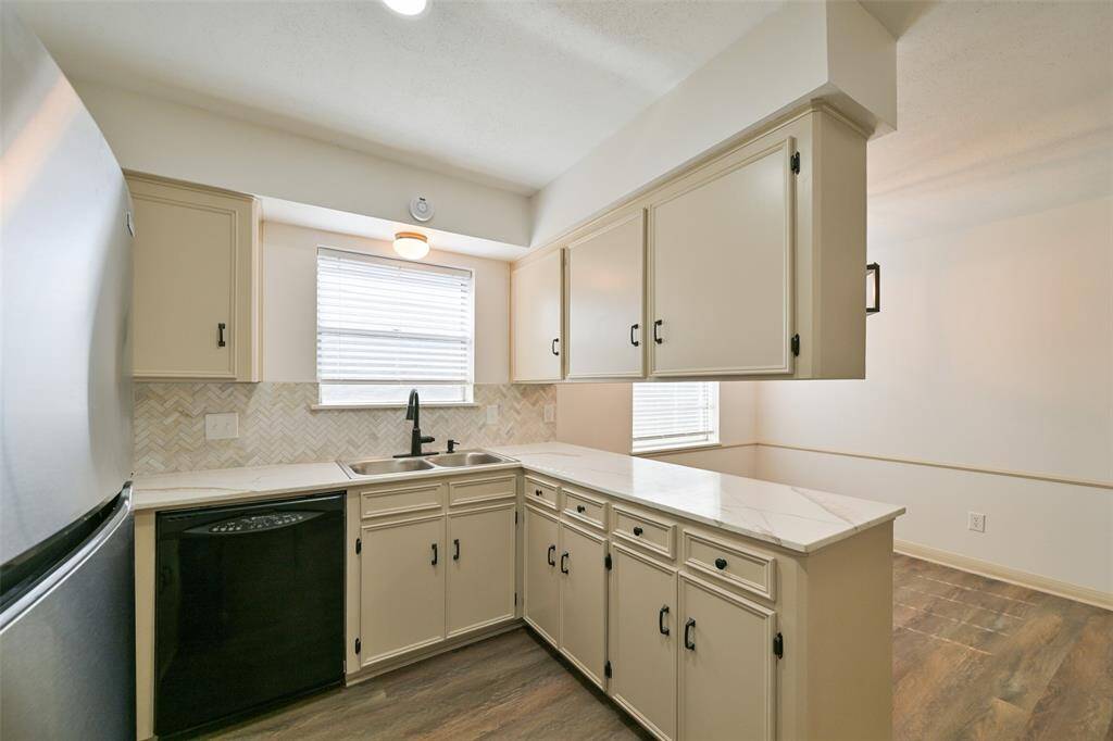 THERE ARE AMPLE CABINETS FOR YOUR CHINAWARE AND DOUBLE SINK.