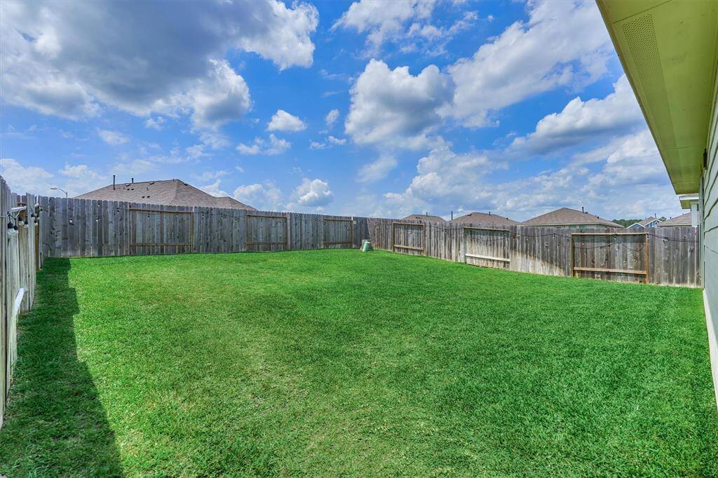 Spacious backyard for entertaining or kids to run around.