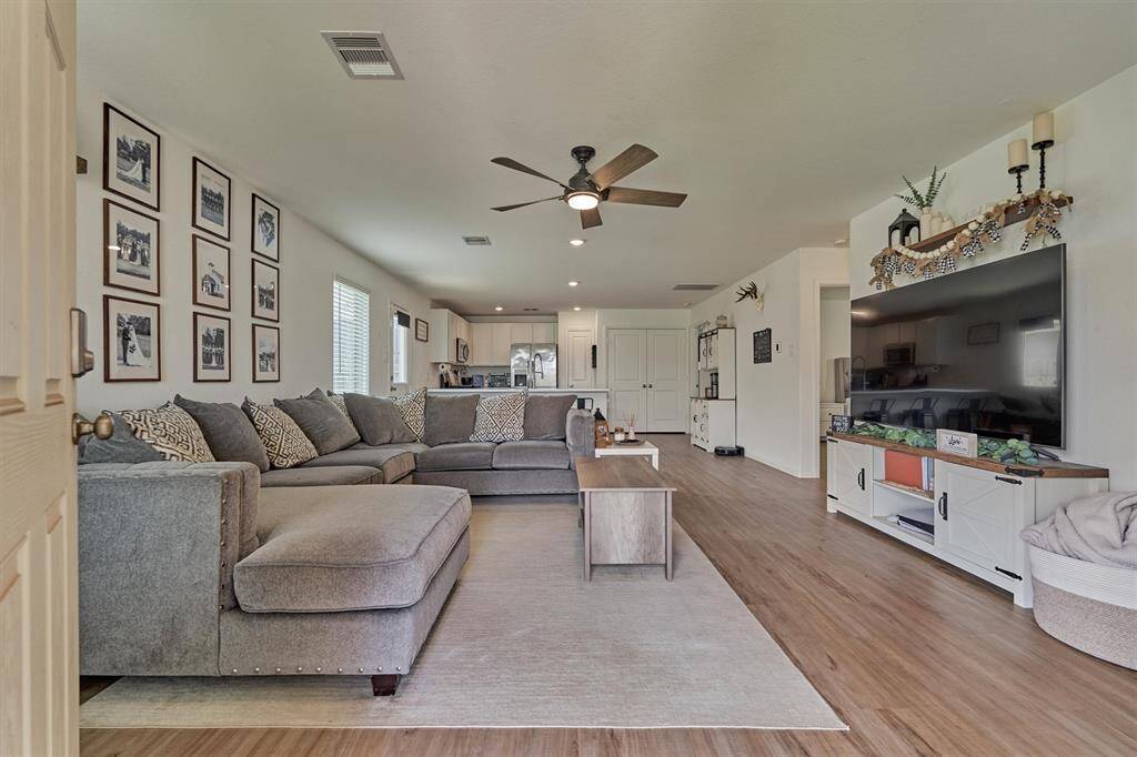 Walk into your open concept living room perfect for entertaining.