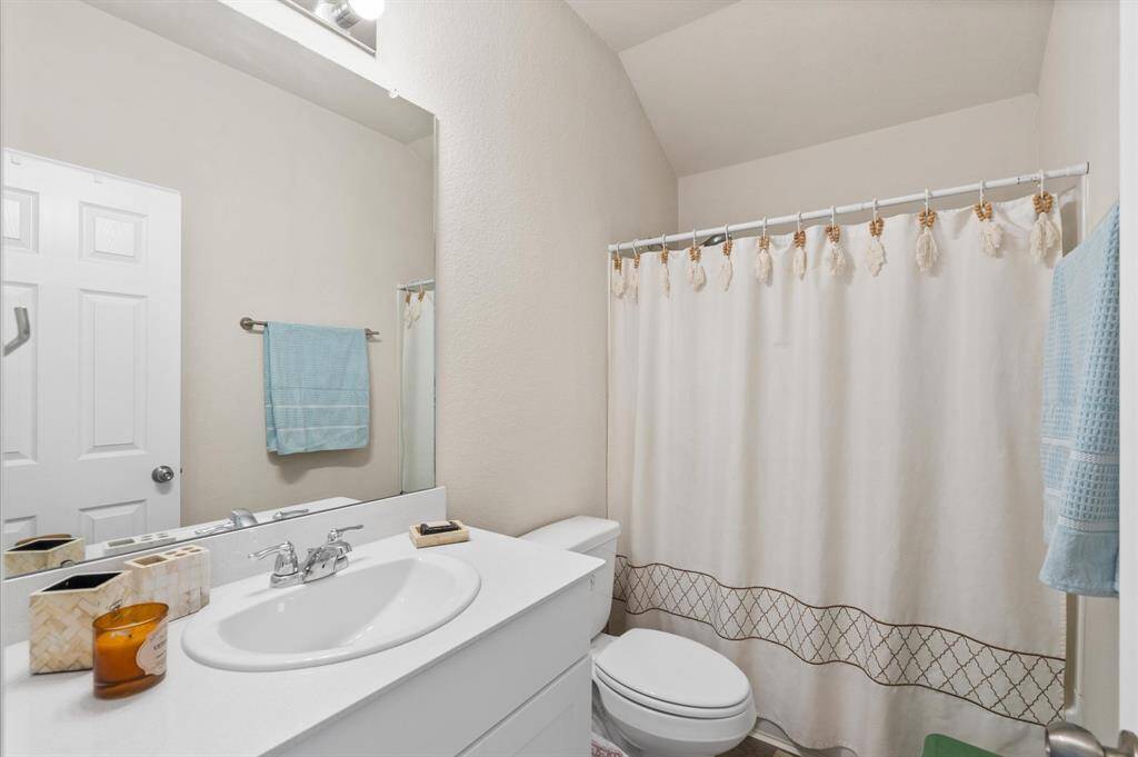 Secondary bathroom with tub and shower.