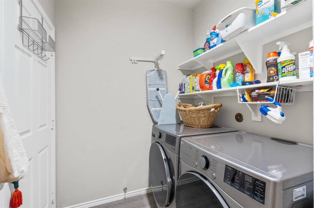 Fully equipped laundry room with washer and dryer included.