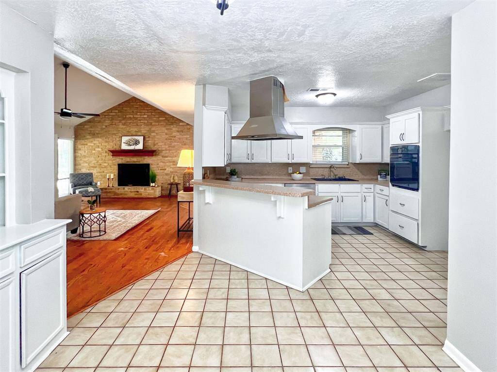 View of kitchen and living room from the breakfast area