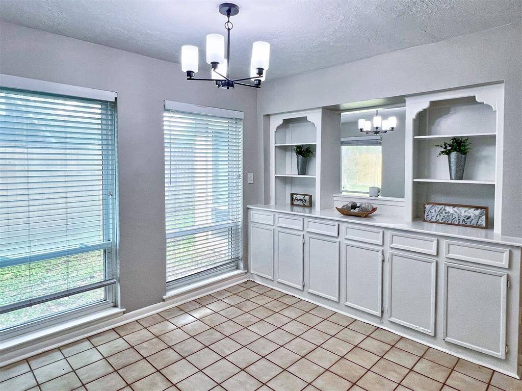 Breakfast area with beautiful built-in cabinets for extra storage