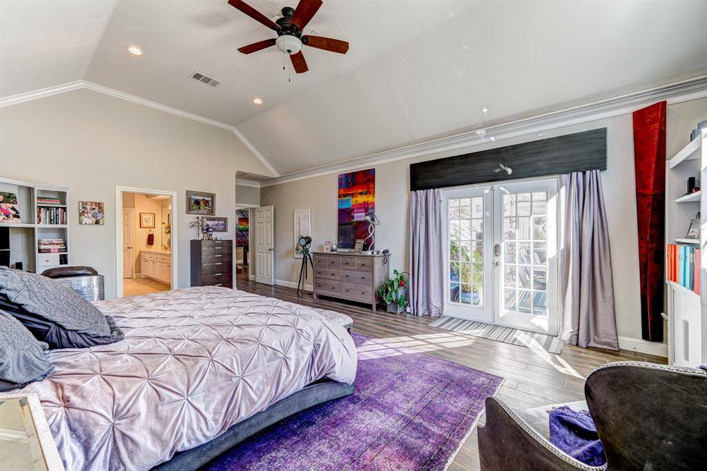 Double doors lead to the covered porch that spans the backyard.
