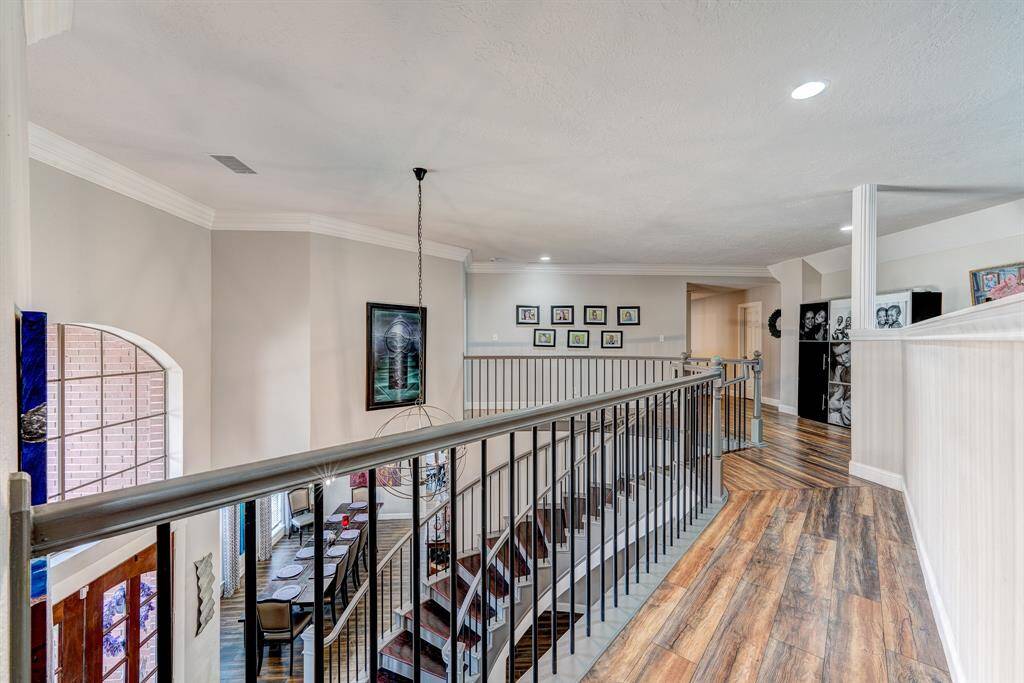 Heading upstairs you overlook the foyer.