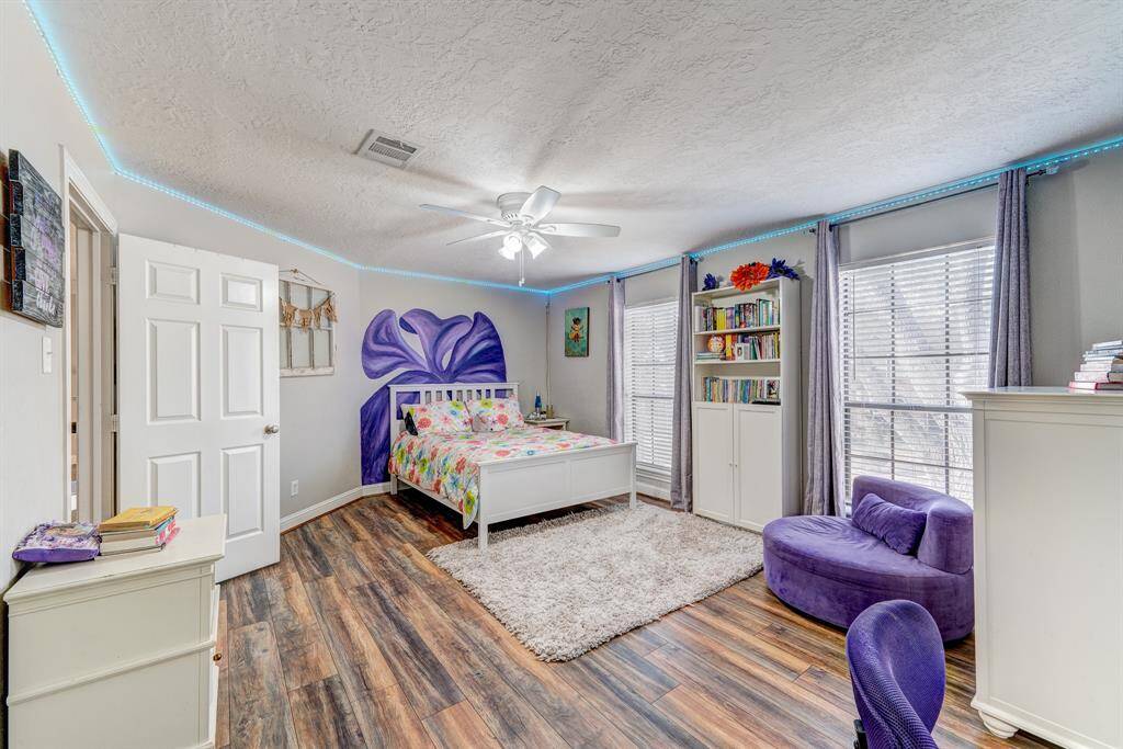 This room is also spacious with front of the house windows.