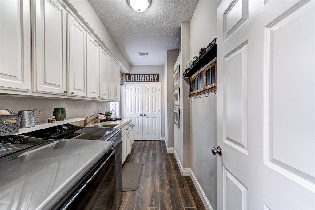 Can't forget about the laundry room.  It is off of the breakfast room with another LARGE storage closet.
