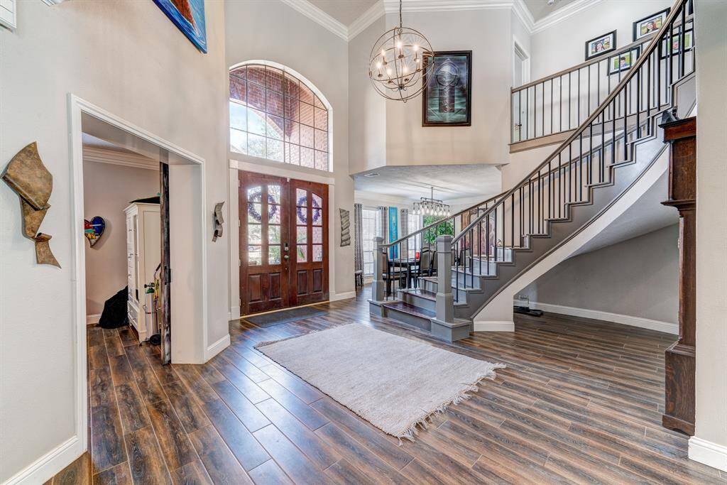 To the right of the doors is a study (being used as a bedroom) with custom sliding barn doors.