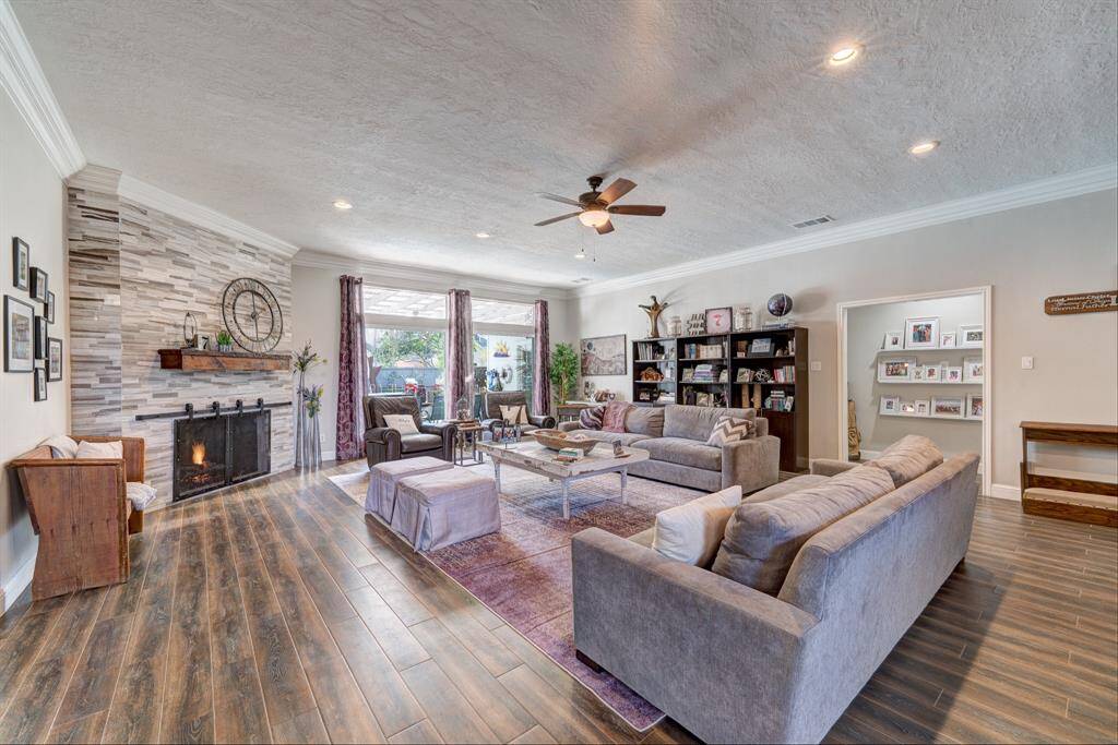 One of the oversized living spaces with picture windows looking over the backyard paradise.