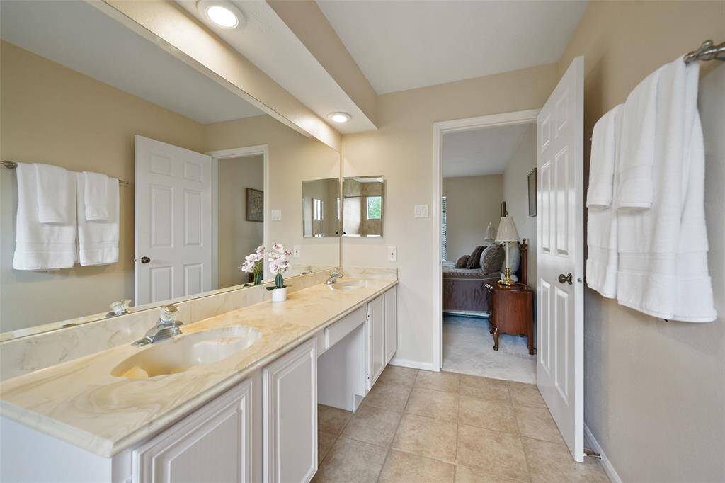 Experience the inviting charm of the primary bedroom from this angle.