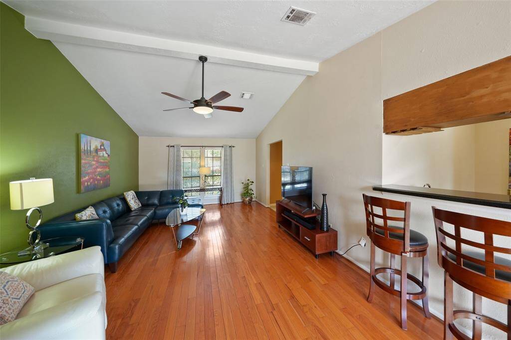 Spacious family room with a stylish wet bar, perfect for entertaining.