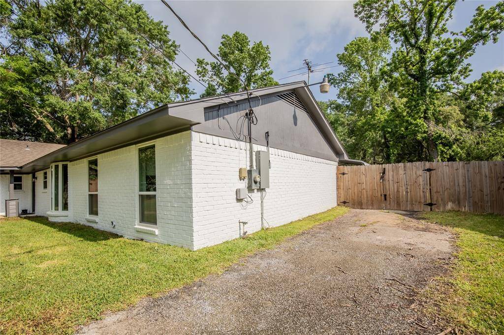 Side gate leads to back yard and rear-entry garage.