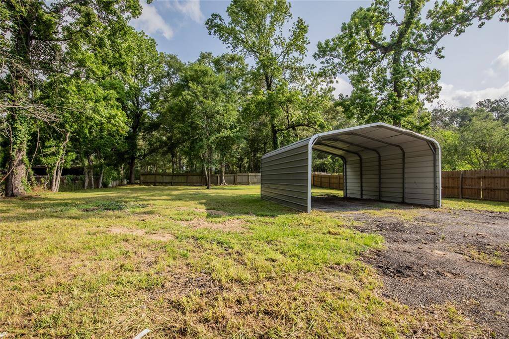 Huge back yard with carport cover.