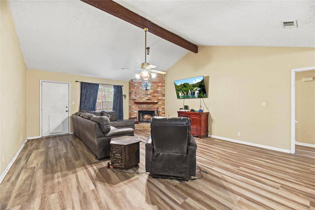 Off the right side of the living room you'll find two secondary bedrooms and a full bath.