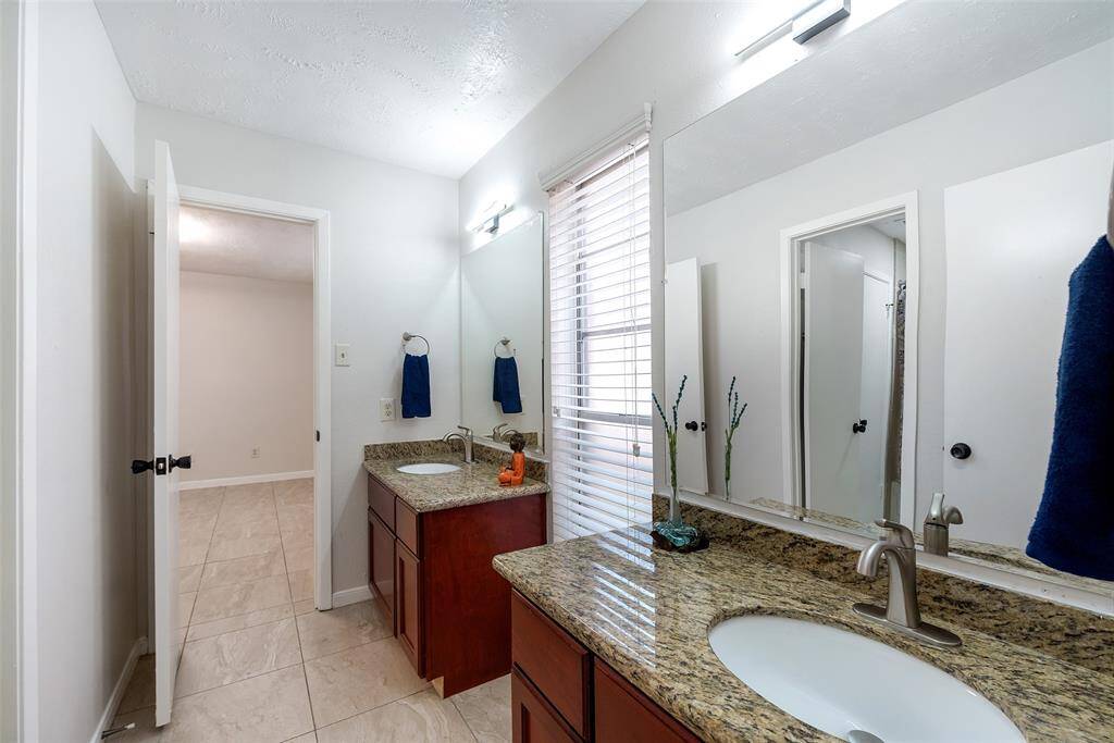 Custom built vanities with modern fixtures.