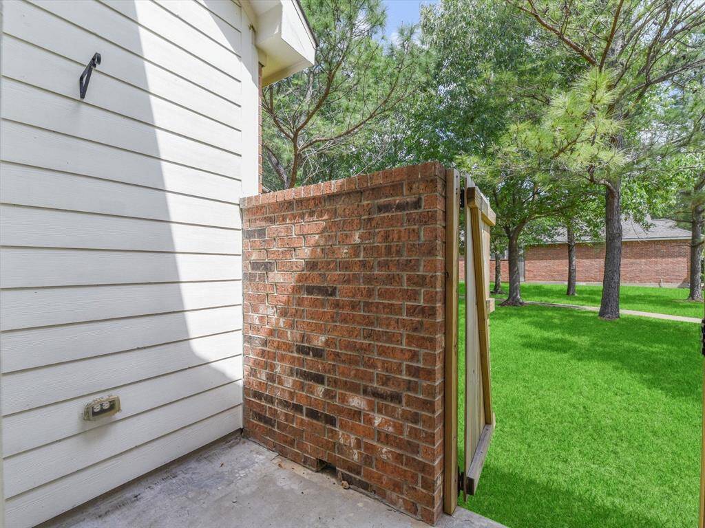 Patio off the 2nd Bedroom with access to the green space.
