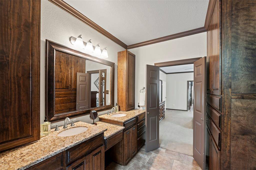There is plenty of drawers and cabinets for storage, from the vanity area to the medicine cabinets, to the linen closet tucked behind the door!