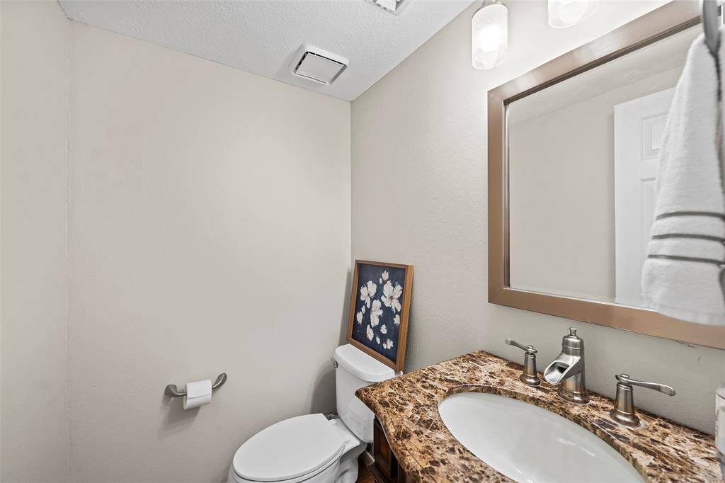 A quaint half bath is the perfect spot for guests and residents to freshen up!