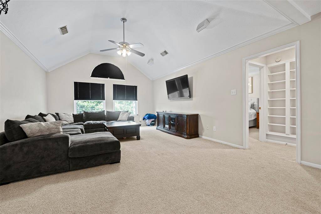 Soft carpet underfoot and the blackout shades make for a cozy evening, cuddling up on the couch with a bucket of popcorn or M&M's, binging on your favorite show! And let's peep to the custom built-ins, ideal for storing games, puzzles, or displaying awards and art!