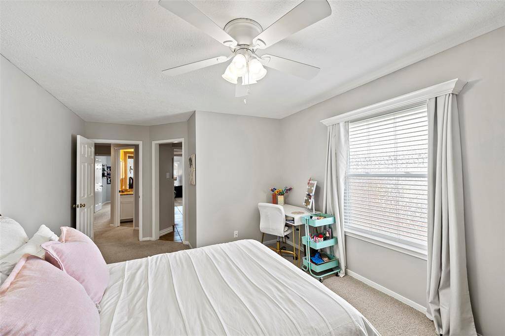 This serene secondary bedroom features a large picture window with tons of natural light and of course, views!