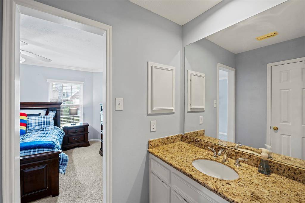 A private vanity area with drawers and cabinets for storage, and an additional medicine cabinet for other needs!