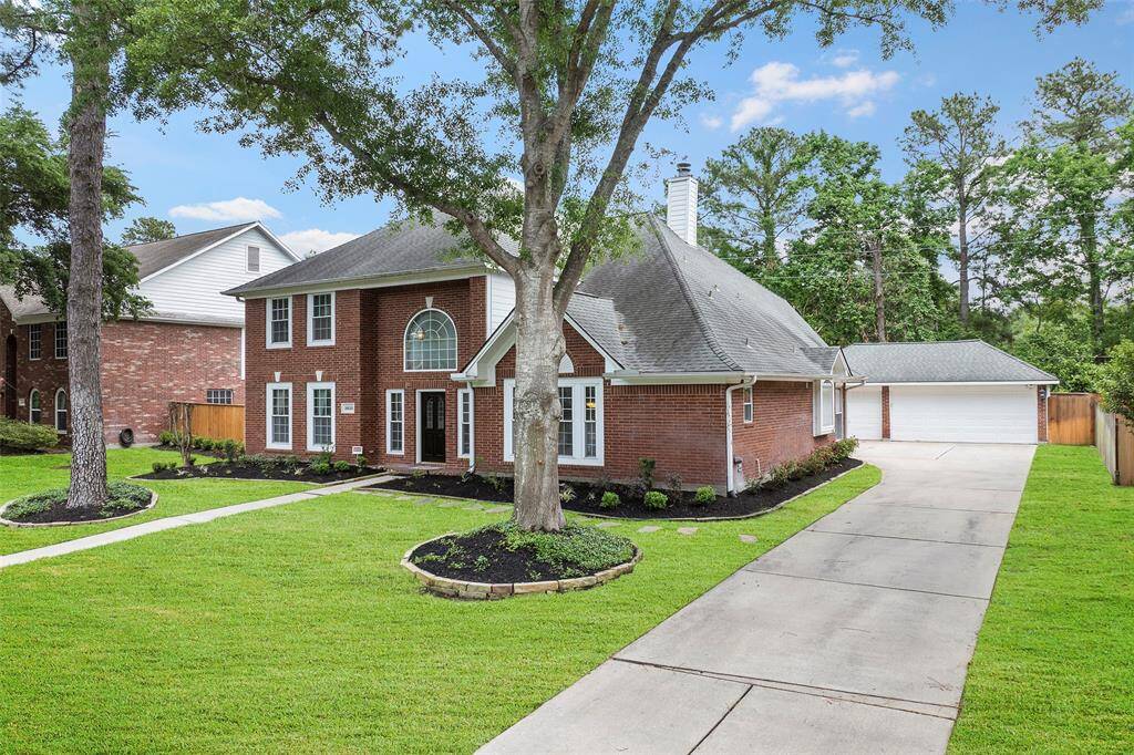 An expansive driveway leads to the detached 3-car garage and provides ample parking for residents and guests alike!