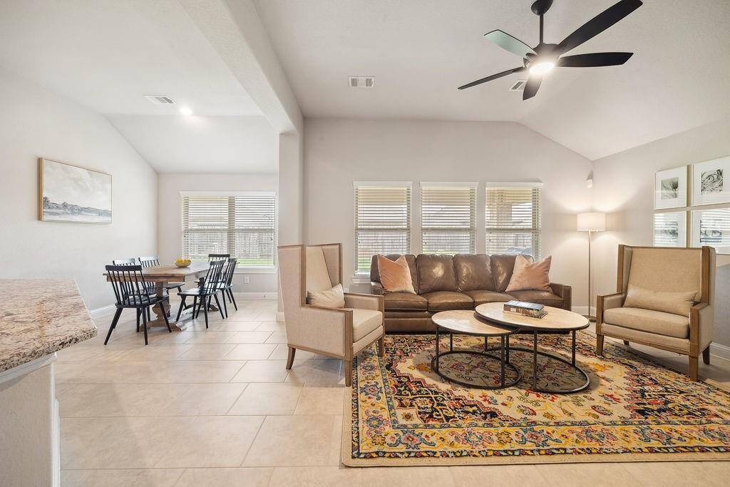 Open floorpan and spacious family room with a warm fireplace, perfect for entertaining.
