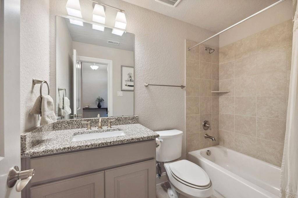 Secondary Bathroom at the front of the home with the two bedrooms.
