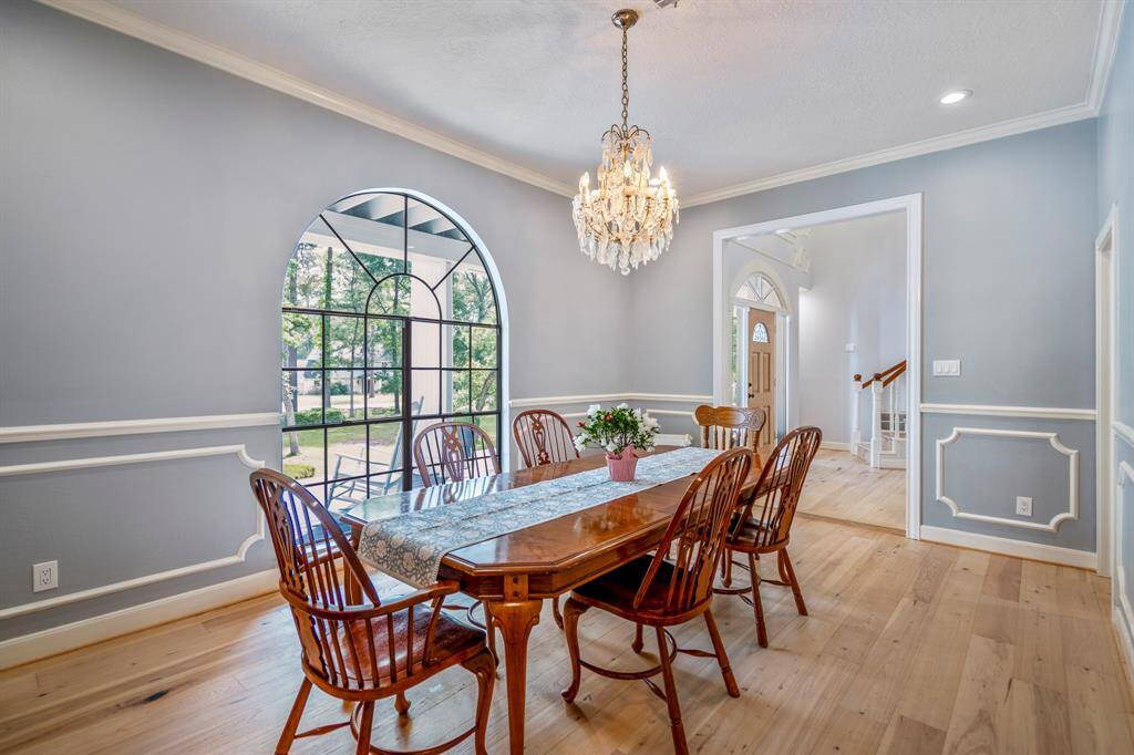 This dining room features a gorgeous arched window and is large enough to seat plenty of guests!