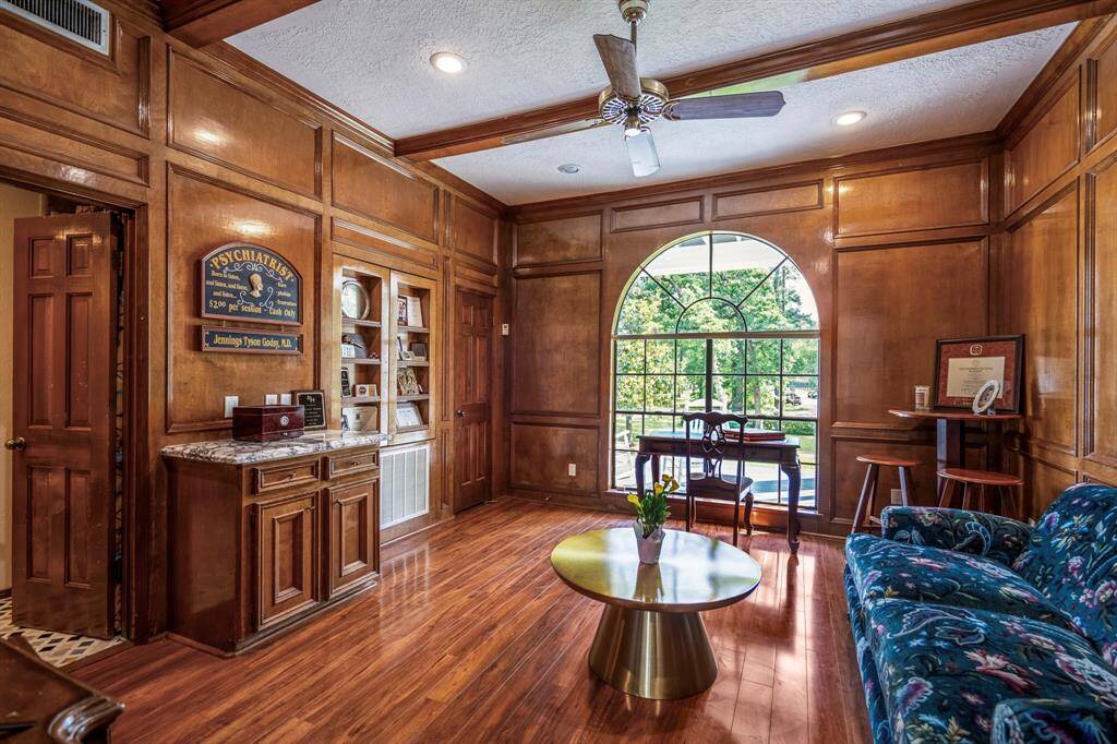 Built-in shelves, and a marble-topped cabinet add the luxury of this study. A ceiling fan and recessed lighting add comfort and ambiance and this room also features its own full bath.