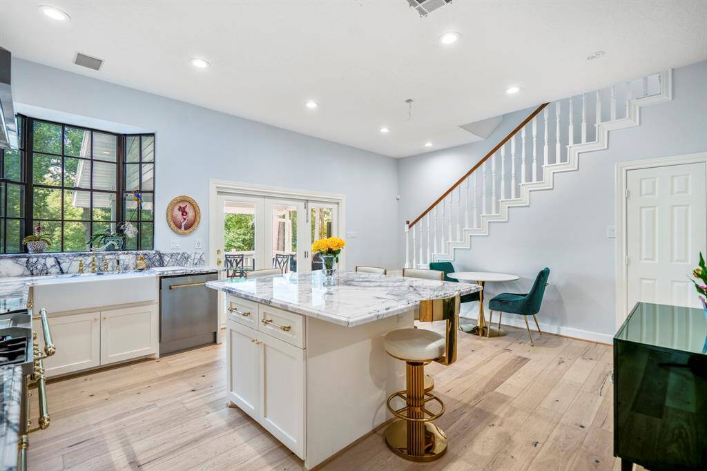 The kitchen is a chef's dream with soft close cabinets, custom hardware, and so much more!