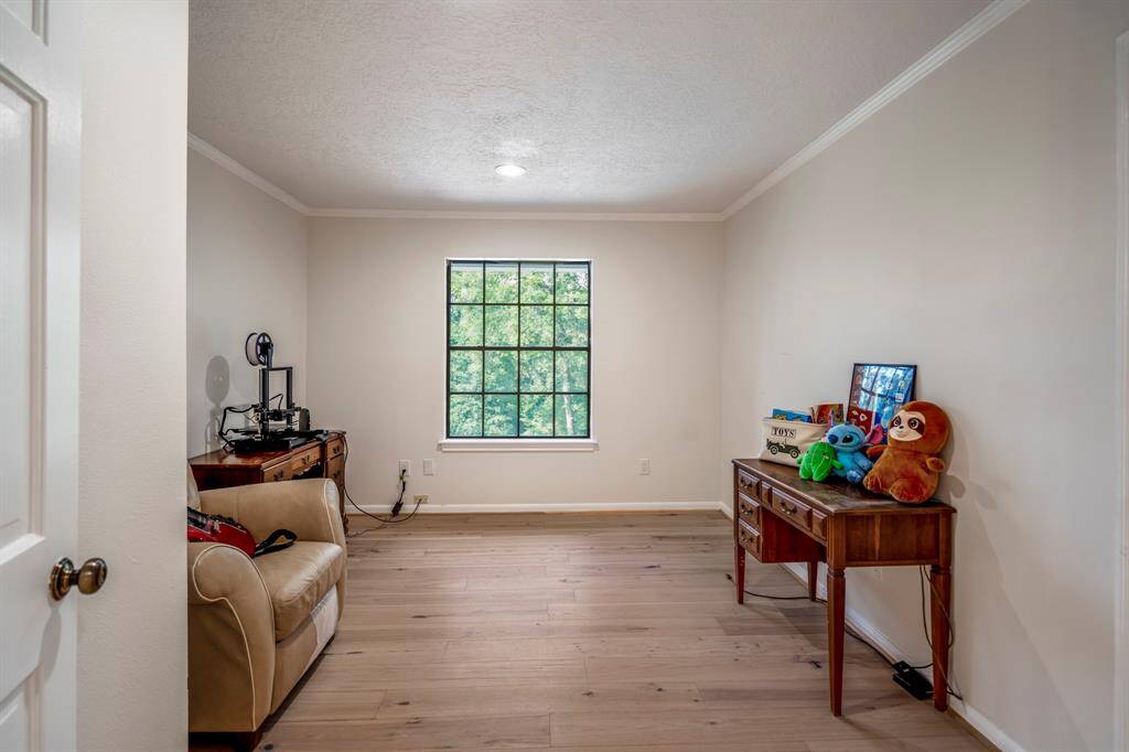 On the 3rd floor is a spacious flex room which is a perfect entertainment space. It includes a ceiling fan, TV projector and screen, and large window, enhancing comfort and natural light.